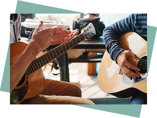 guitar lesson with teenager and guitar teacher